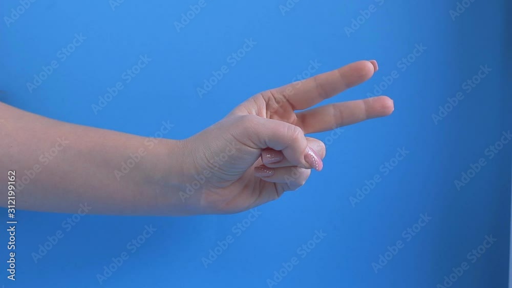 female palm shows a sign of victory, gestures female palm shows a sign of victory, gestures