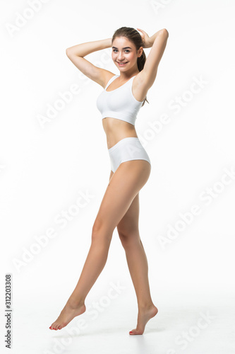 Full height of young woman in white underwear isolated on white background