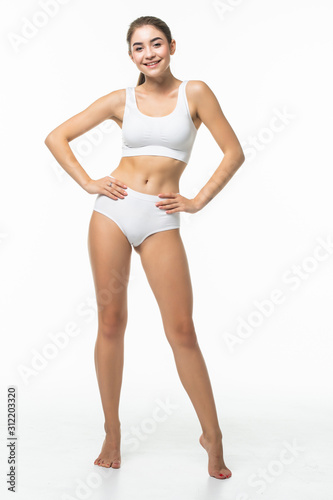 Full height of young woman in white underwear isolated on white background