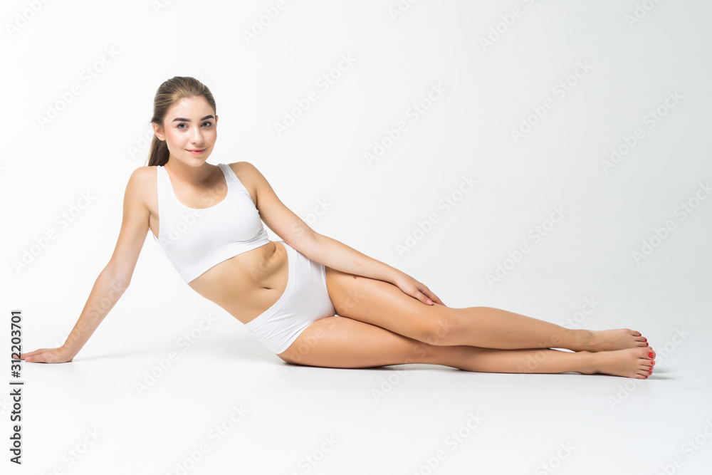 Young woman with a beautiful long legs isolated on white background