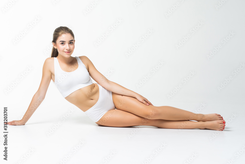 Young woman with a beautiful long legs isolated on white background Young woman with a beautiful long legs isolated on white background