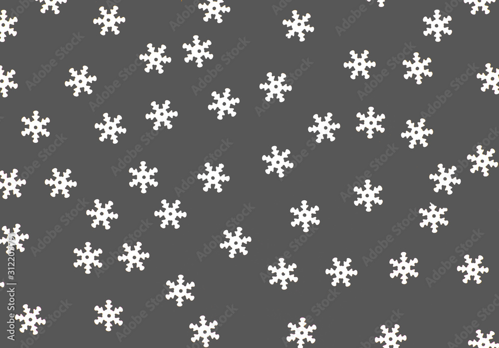 White decorative snowflakes on a gray background for signature and design. White decorative snowflakes on a gray background for signature and design.