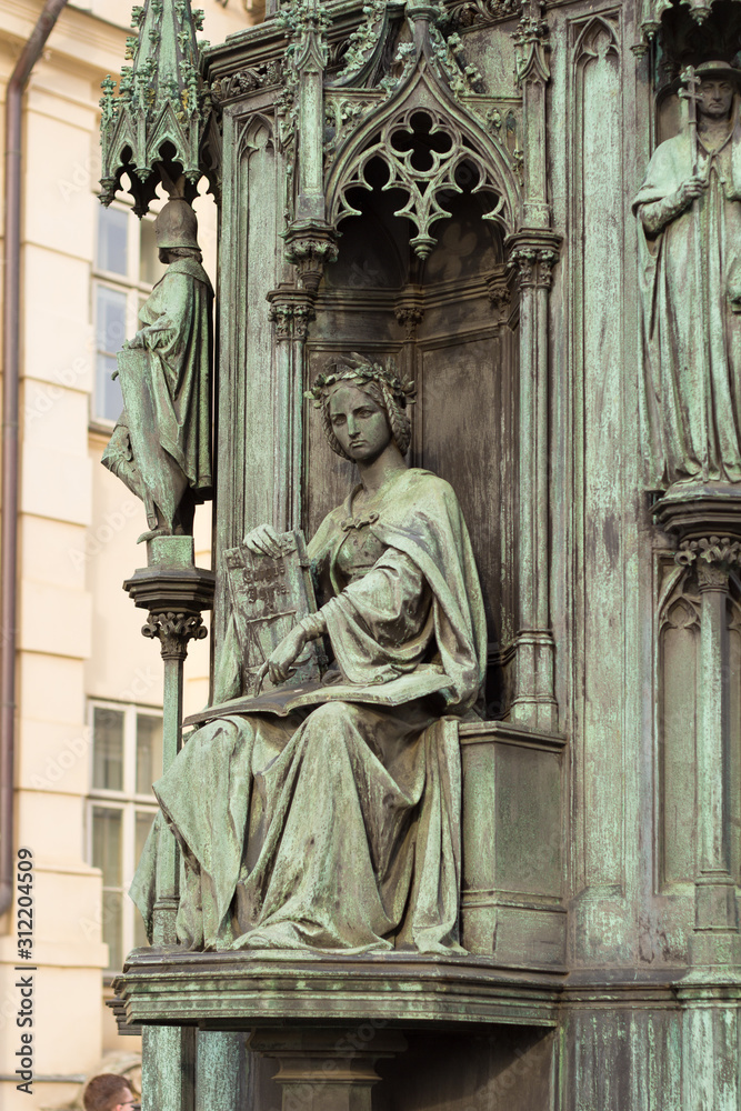 neo-gothic statue of woman holding book