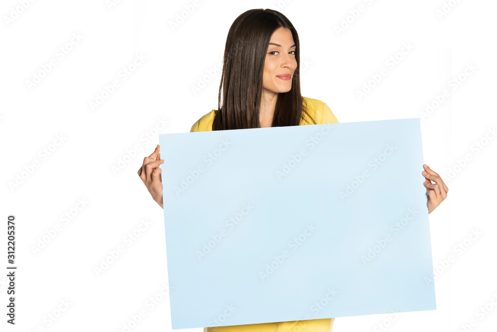 young beautiful happy woman holding a blue empty board on white background young beautiful happy woman holding a blue empty board on white background