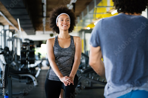 Picture of cheerful fit fitness team in gym