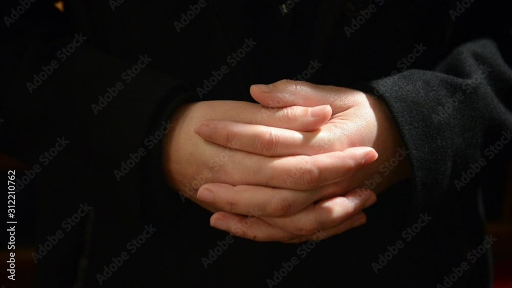 Wideo Stock Praying hands of christian woman praying in Cathedral