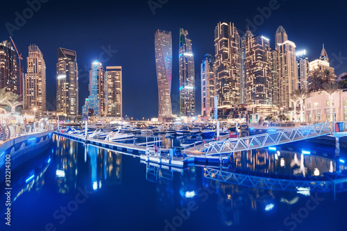 Parking for luxury yachts and boats in the popular district of Dubai Marina © EdNurg