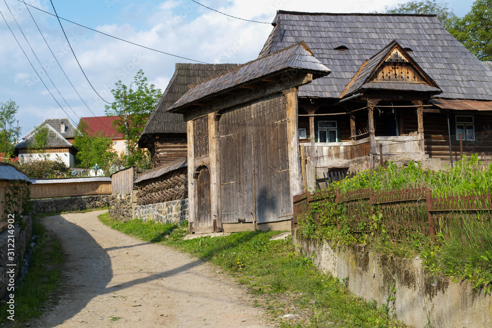 Traditional gate outside a home in the village of Budesti in the Maramures region of Romania Traditional gate outside a home in the village of Budesti in the Maramures region of Romania