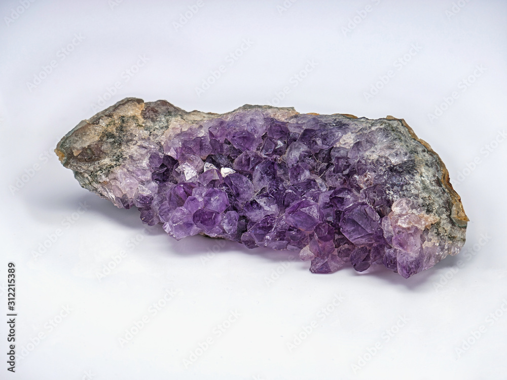 Close-up of amethyst geode, semi-precious purple crystal, macro, isolated on white, expanded depth of field with focus stacking