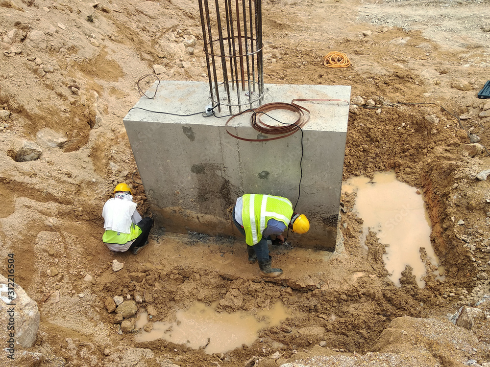 Casted pile cap at the construction site. It is part of the building foundation system. Protruded rebar is for the next stage of work. Casted pile cap at the construction site. It is part of the building foundation system. Protruded rebar is for the next stage of work.