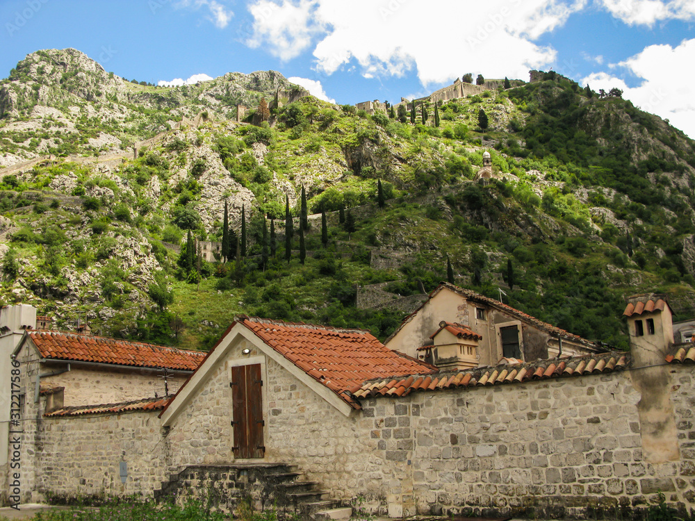 fortress wall of the old city and part of the ancient walls on the mountain in the Kotor city