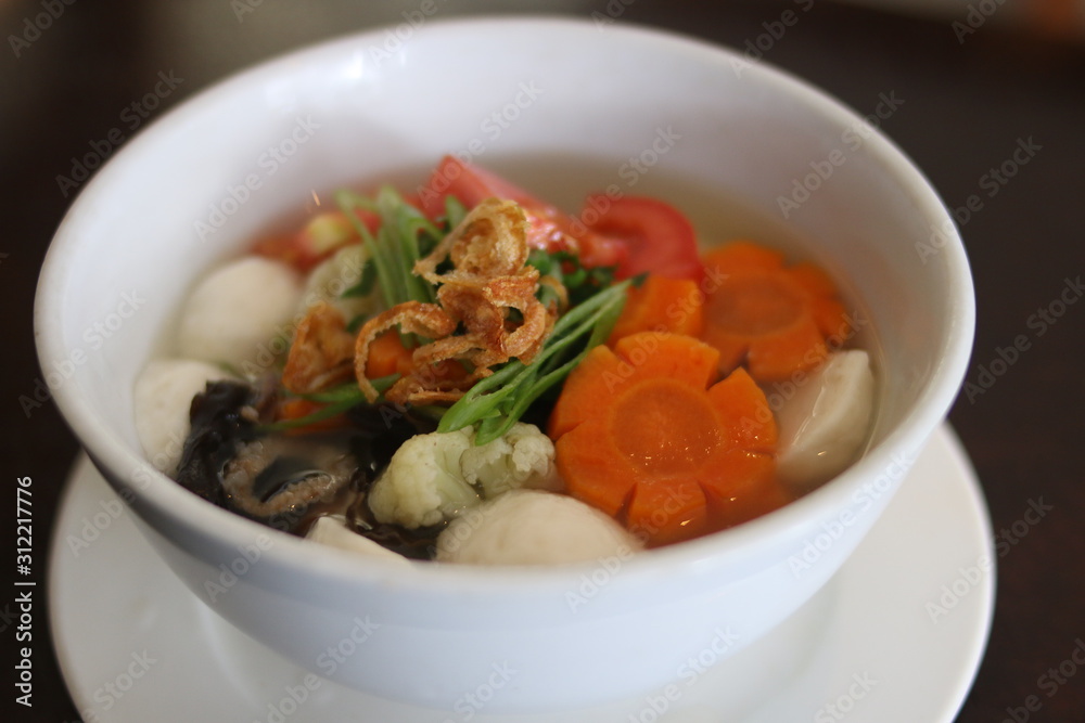 Hot soup with meatballs, mushroom, broccoli and carrots. Close up view Hot soup with meatballs, mushroom, broccoli and carrots. Close up view