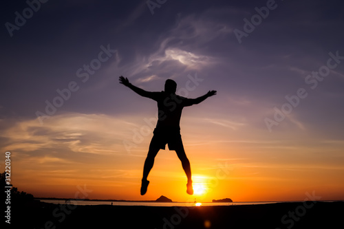 Fototapeta Naklejka Na Ścianę i Meble -  silhouette of a man on sunset background of the sky