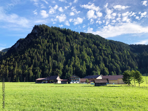 Traditional architecture and farmhouses in the Sihltal valley and by the artifical Lake Sihlsee, Studen - Canton of Schwyz, Switzerland photo