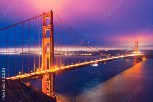 Beautiful view of the glowing Golden Gate in San Francisco after sunset