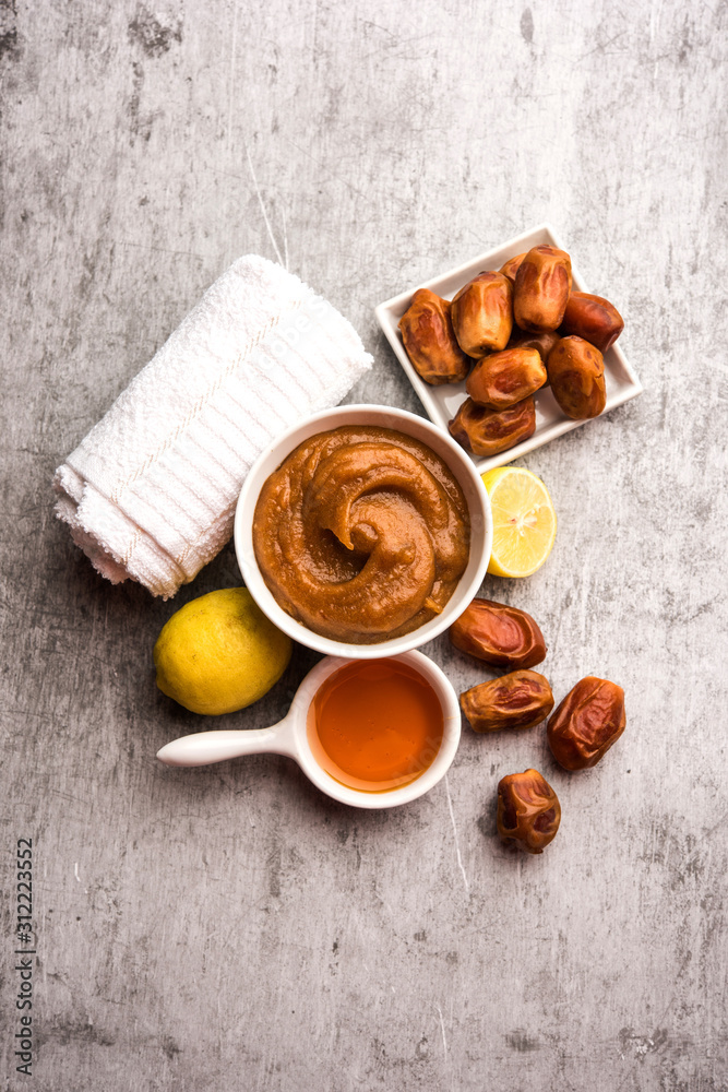Dates Face mask for supple, smooth and clear skin with ingradients like fresh raw khajoor, lemon and honey. selective focus Dates Face mask for supple, smooth and clear skin with ingradients like fresh raw khajoor, lemon and honey. selective focus