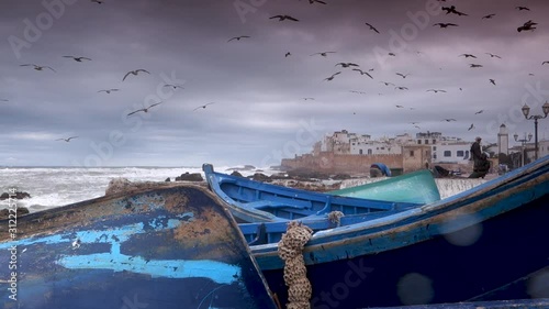 Fishing boats in the foreground and Essaouira, Morocco in the distance. photo