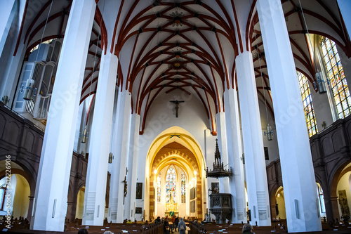 Interior of Lutheran St. Thomas Church Thomaskirche in Leipzig, Germany. November 2019