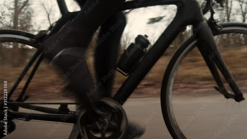 Cyclist Riding On Road Bike.Cycling On Puddle And Splashing Water At Fall.Bike Wheels Rides Through Puddle.Water Spray From Bicycle Wheel.Triathlete Cyclist Training For Triathlon.Sport Concept Cyclist Riding On Road Bike.Cycling On Puddle And Splashing Water At Fall.Bike Wheels Rides Through Puddle.Water Spray From Bicycle Wheel.Triathlete Cyclist Training For Triathlon.Sport Concept