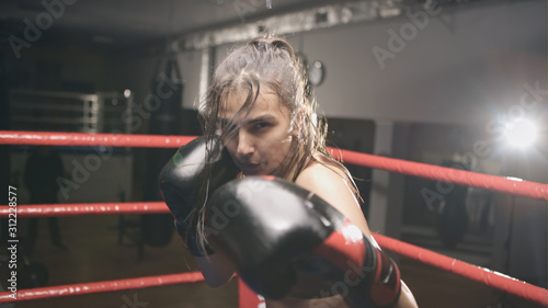 Young beautiful girl persistently stalled in camera in the ring