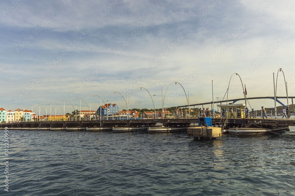 Gorgeous view of the moving pontoon Queen Emma Bridge across St. Anna Bay. Willemstad. Curacao. 