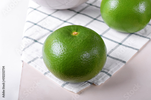 Whole sweetie fruit against the white background