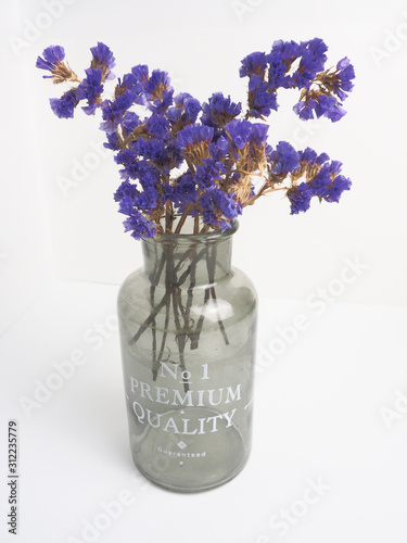bouquet of flowers in vase isolated on white