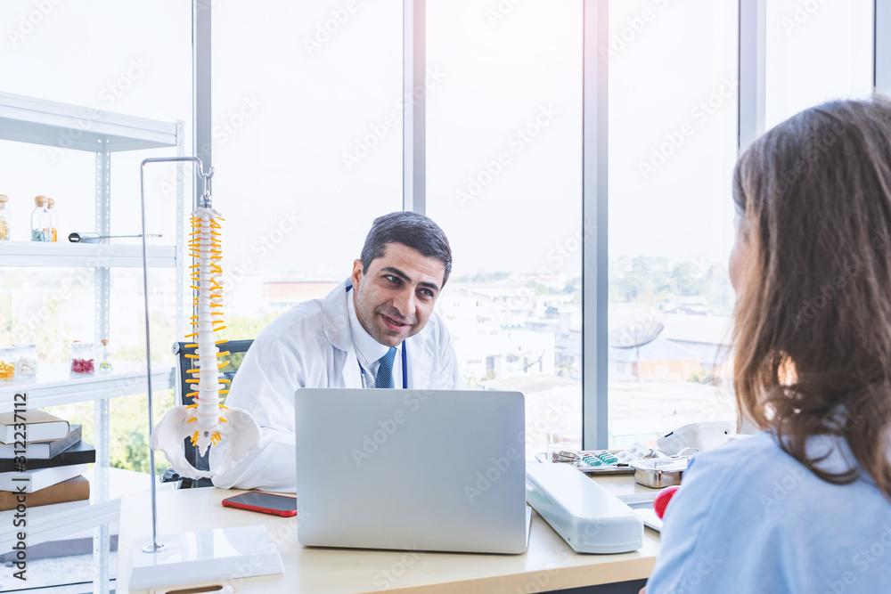 Doctor work consulting and examining patient woman for her health in seriously Doctor work consulting and examining patient woman for her health in seriously