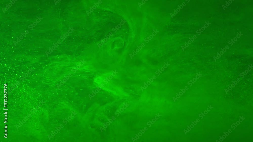 Paint fall into water which is twist. Spin acrylic ink drip into liquid. Visual effect bullet time, frozen moment, flow motion. Cloud fraction of color is spray drop. Slow motion cosmic video magic.
