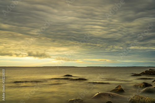 Fototapeta Naklejka Na Ścianę i Meble -  Long exposure seascape along Nova Scotia's rocky seacoast shoreline.