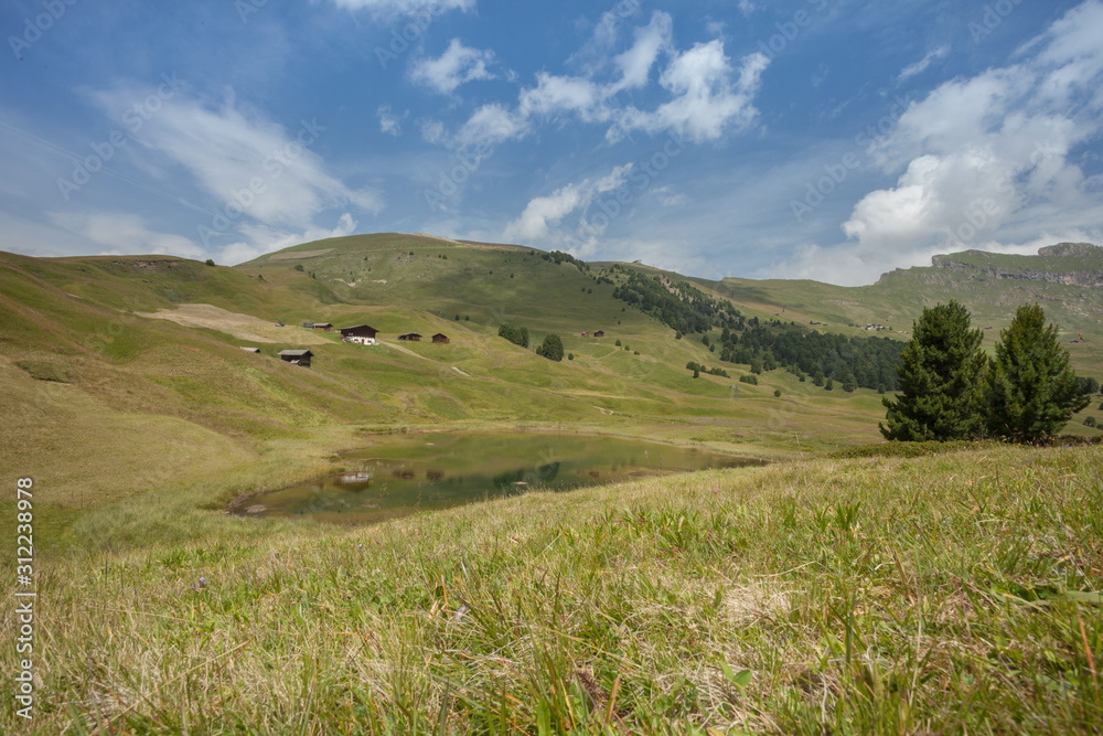 alpine lake in the Seceda area among the Italian Dolomites