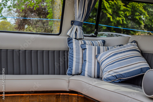 Blue Cushions in the back of a camper van