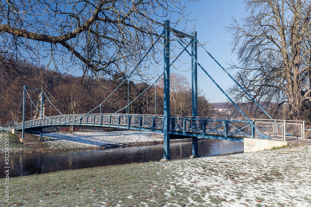 Fototapeta premium small bridge over a river in winter