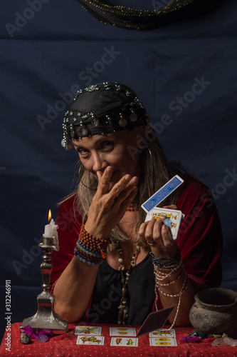 Gypsy fortuneteller or esoteric Oracle read the cards