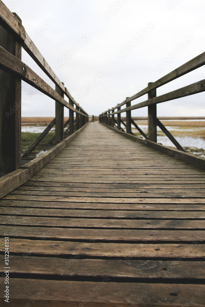 old wooden pathway over the lake old wooden pathway over the lake