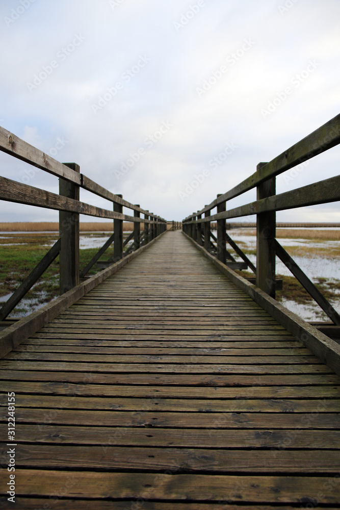 old wooden pathway over the lake old wooden pathway over the lake