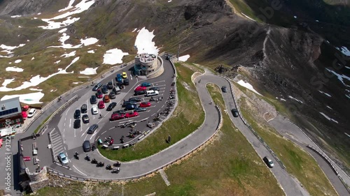 Aerial rotation view point of Grossglockner Hochalpenstrasse - Scenic Alpine road in Austria, sunny summer day, blue sky. Motorcyclists and car travelers. vacation and adventure, (Edelweissspitze)