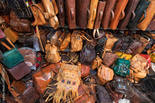 The traditional handmade leather handbag and slippers and other product is displayed in the tannery and showroom in the souk of Fes. Morocco
