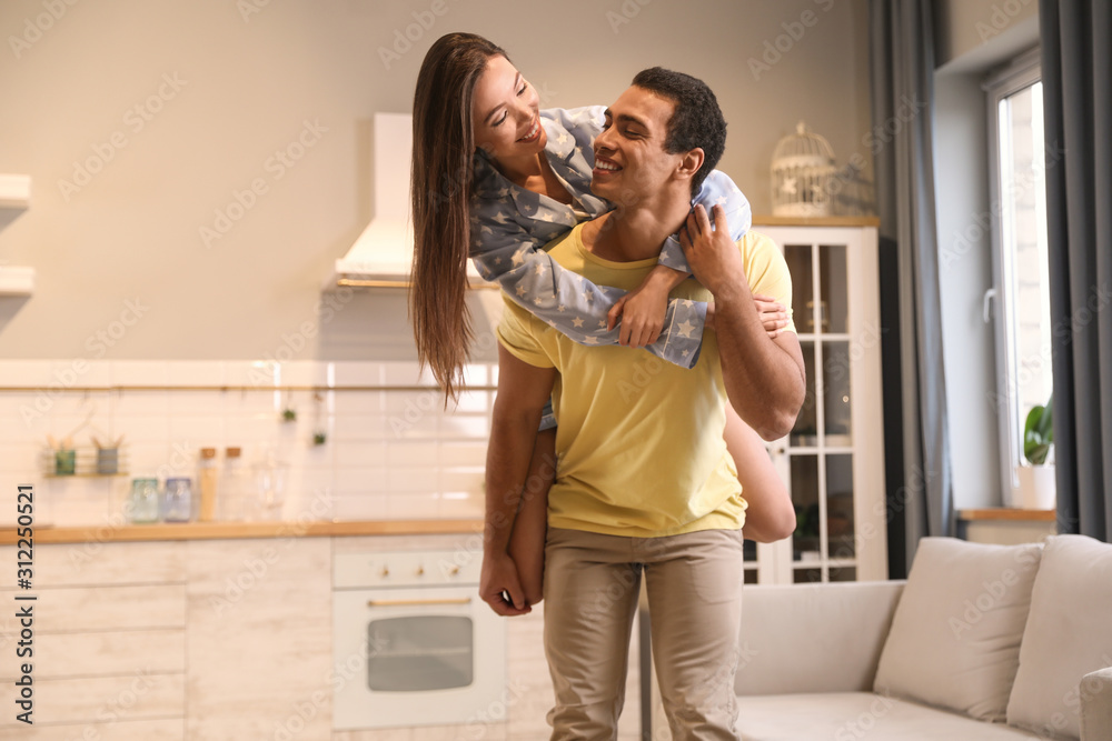 Lovely young interracial couple having fun at home Lovely young interracial couple having fun at home