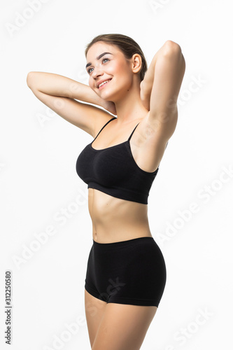 Young pretty woman with perfect body wear in black underwear isolated on white background