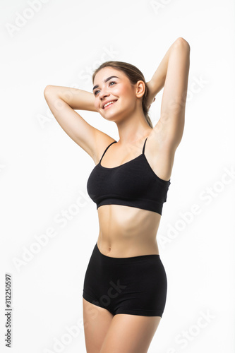 Young pretty woman with perfect body wear in black underwear isolated on white background