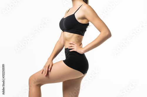 Young pretty woman with perfect body wear in black underwear isolated on white background