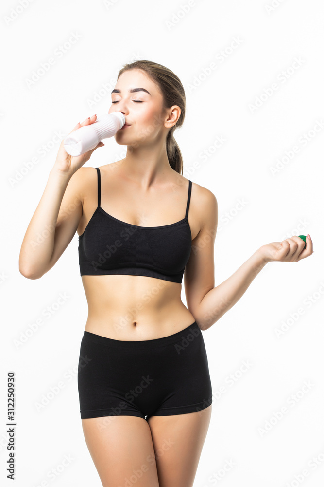 Young, healthy and attractive brunette woman in black underwear drink yogurt from bottle isolated on white background Young, healthy and attractive brunette woman in black underwear drink yogurt from bottle isolated on white background