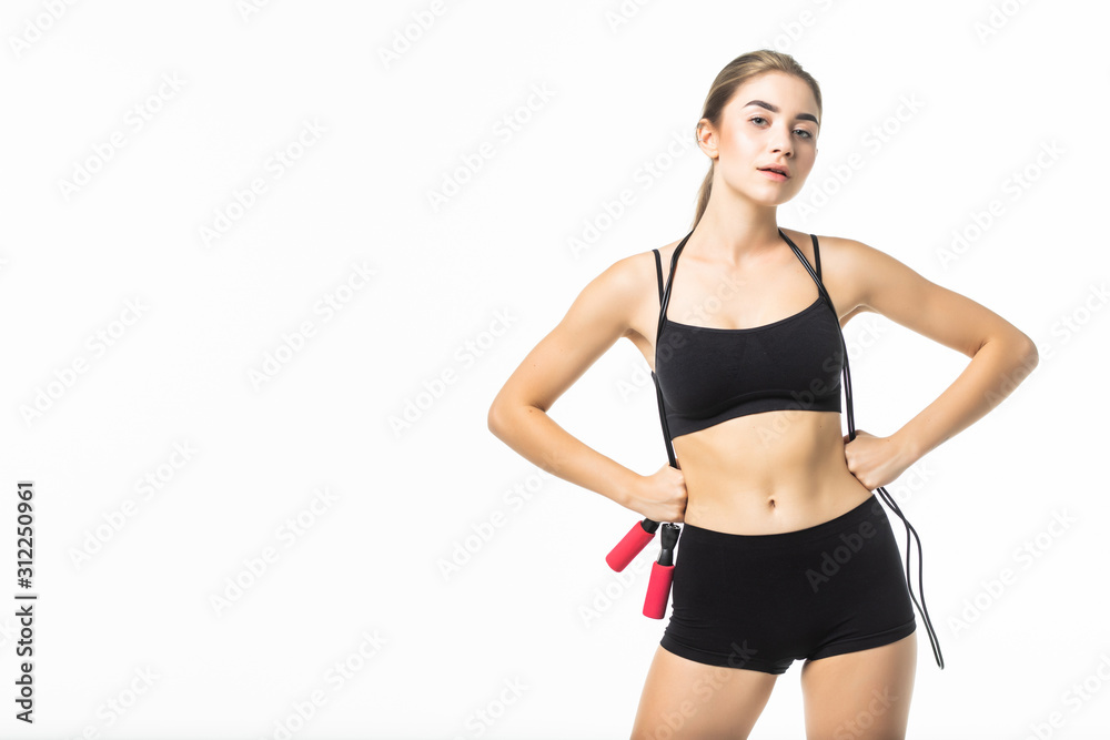 Young woman in black underwear with a jump rope isolated on white background Young woman in black underwear with a jump rope isolated on white background