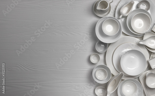 Set of empty dishware on white background with copy space photo