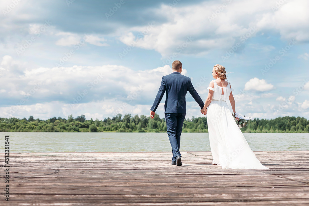 bride and groom on the pier. copy space