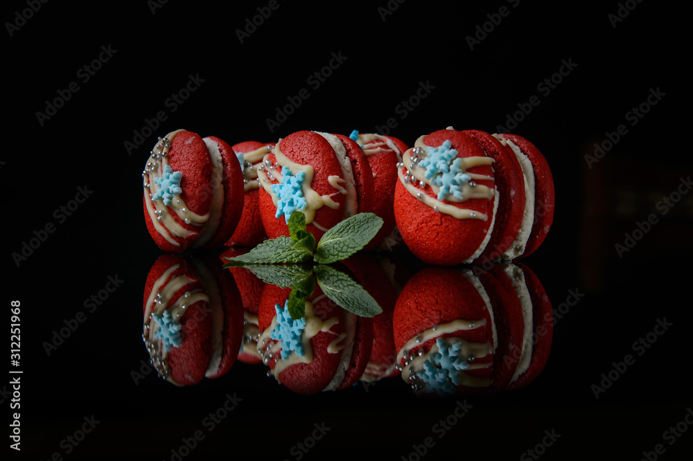 red macaroons on a black background