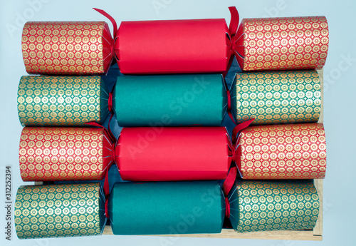 Four Christmas crackers in a box