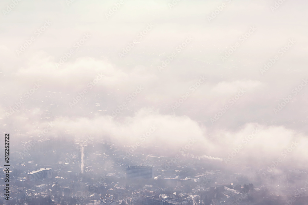 Fototapeta premium aerial view of the city through the clouds