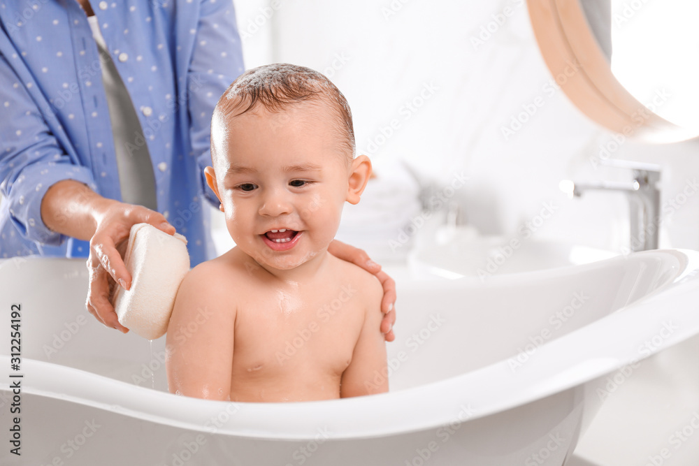 Mother with her little baby in bathroom Mother with her little baby in bathroom